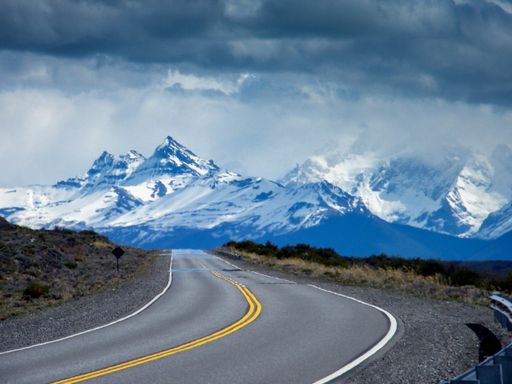 A breathtaking view of the majestic Aoraki Mount Cook with the road leading to Mount Cook Village, New Zealand