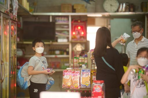 A closeup shot of people in masks in a local grocery store in Shek Kip Mei, Hong Kong