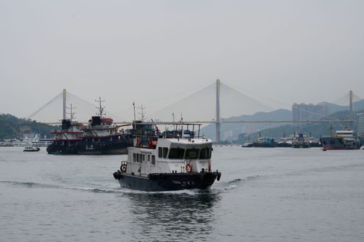 A view of boats and Ting Kau Bridge on a cloudy day in Hong Kong, China