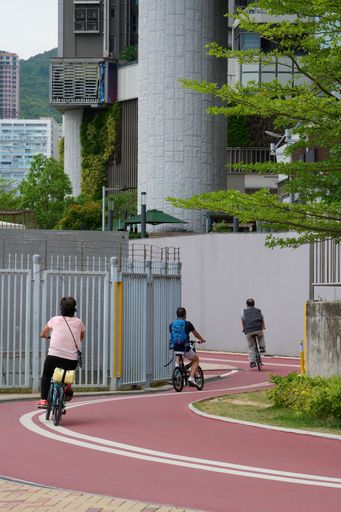 A beautiful shot of people riding a bicycle in Tsuen Wan, Hong Kong