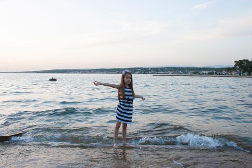 A little girl having fun on a beach