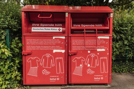 A red container from the german red cross to collect old clothes and shoes