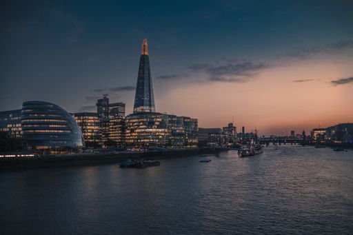 City of London landscape at sunset, looking towards the southbank from the London Brigde atop the Thamesis