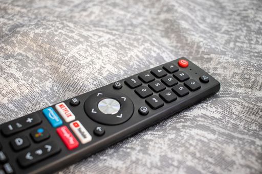 A black remote controller of a TV