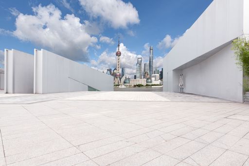 An empty ground floor in front of modern architecture exterior.