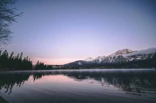 A beautiful view of the Louise Alberta mountain lake at sunset in Banff, Canada