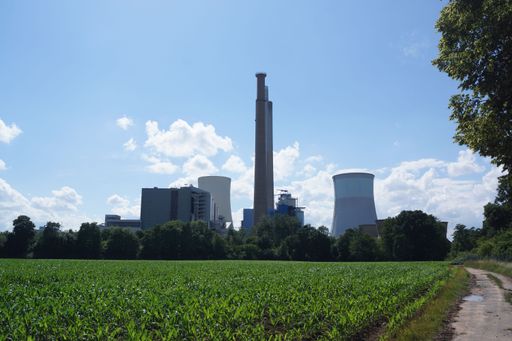 Silhouette of the Staudinger coal-fired power plant near Hanau, Germany. Agricultural landscape and blue sky. Mostly decommissioned.