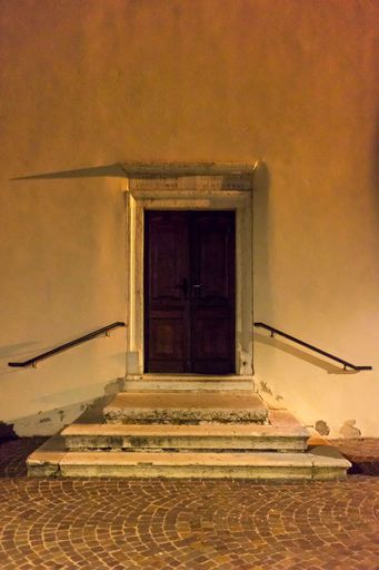 An old wooden door with several steps