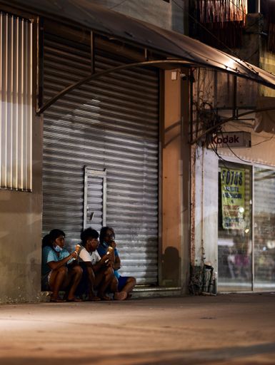 The people sitting in the street and eating ice cream during the pandemic in Tulum, Quintana Roo, Mexico