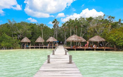 Cabanas shade tourists at the relaxing resort-like atmosphere at Mexico's Kaan Luum Lagoon.
