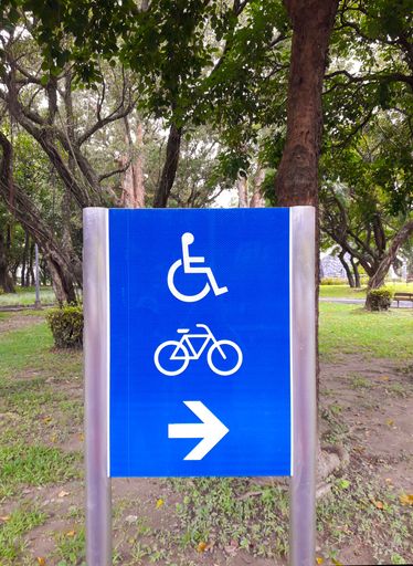 Direction sign for bicycles and wheelchairs in the park in Taipei, Taiwan