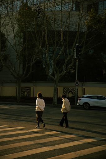 A vertical shot of the people crossing the road. Shanghai, China.