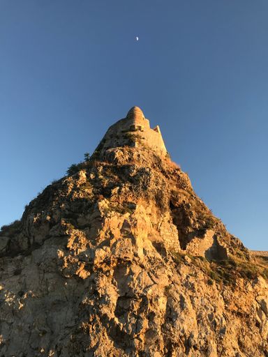 A view of cliff under blue bright sky in Greece