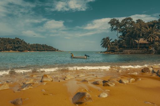 A fisherman in his small boat in the ocean