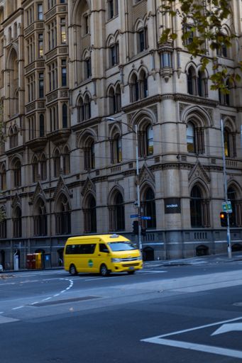 A vertical shot of a Yellow Taxi in Melbourne