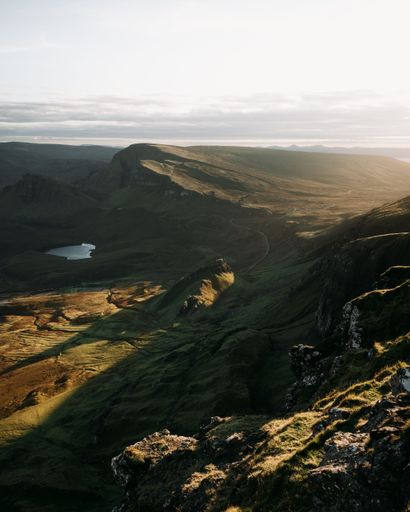 A vertical shot of the rural hills and cliffs in the Isle of Skye, Scotland