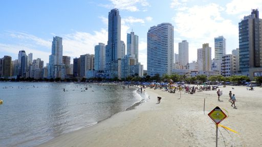 A beautiful shot of people swimming and sunbathing on Pontal Do Sul Beach, Brazil