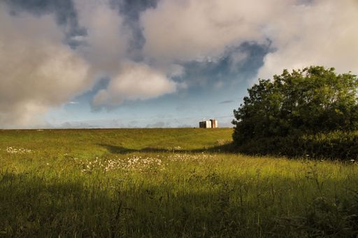 A beautiful scenery of green landscape under cloudy sky