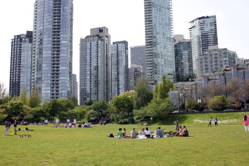Several groups of people relaxing on a sunny day in downtown Vancouver, British Columbia, Canada