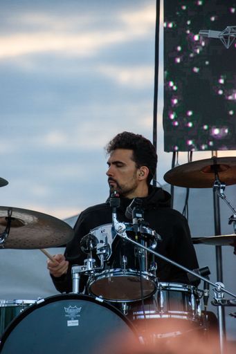 a closeup of drummer at Valeria Stoica live concert at Hangariada, aeronautical festival in Lasi, Romania