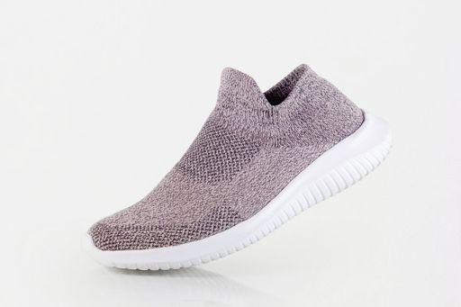 A closeup shot of pink slip-on shoe on white background
