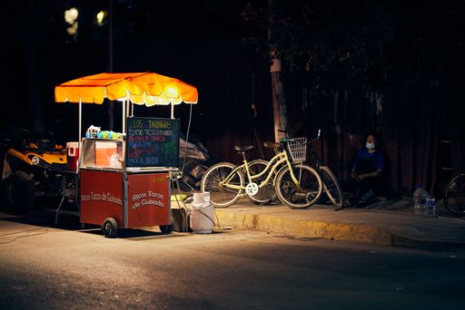 An illuminated street vendor at night during a pandemic in Tulum, Quintana Roo, Tulum