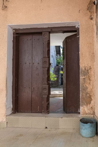 Old wooden door in Stone Town in Zanzibar island, in the historic center