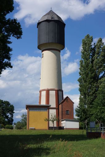 The historic water tower Wahlersee in Hanau-Grossauheim, Germany against blue sky. Built in 1912, a cultural monument. Nice colorful contrast.