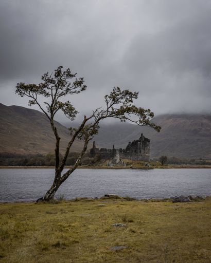A vertical shot of Kilchurn Castle on a cloudy day. Lochawe, Dalmally, UK.