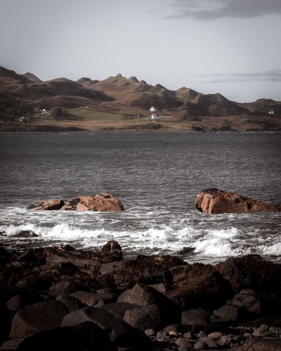 A beautiful landscape of highlands and a rocky sea in Skye island, Scotland.