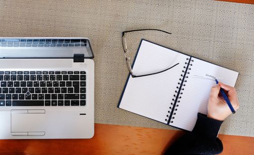 Drafting the strategy for the next year in a notebook