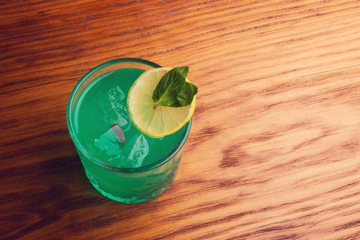 An overhead shot of alcoholic beverage on a wooden table