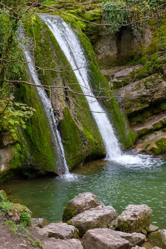 A  vertical shot of the Janet's Foss waterfall in the Yorkshire Dales, England