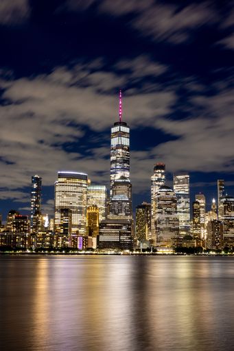 A vertical shot of Freedom Tower and modern buildings in NYC, USA