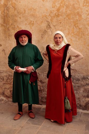 A nobleman, member of the Universita, governing body in the 15th century and noblewoman in period costume. Reenactment of 15th Century life at Mdina,