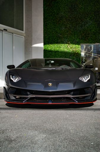 A matte black Lamborghini Aventador SVJ luxury car