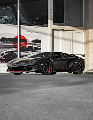 A matte black Lamborghini Aventador SVJ luxury car