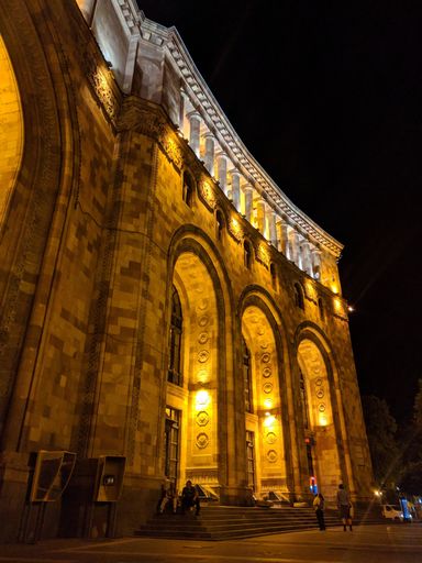 A vertical grayscale low angle shot of the building at the Republic Square in Yerevan, Armenia