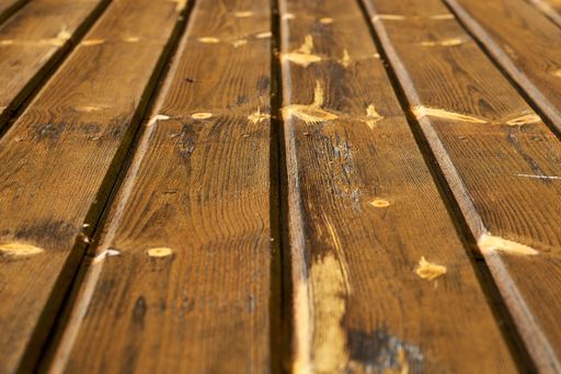 A closeup shot of old wooden planks texture with scratches