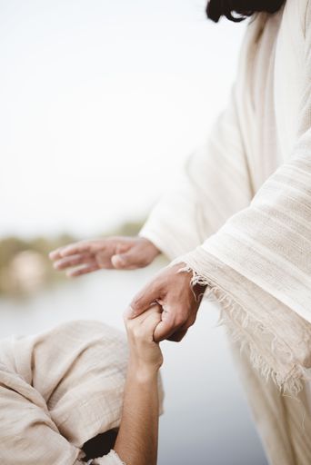 A biblical scene - of Jesus Christ healing the female with a blurred background