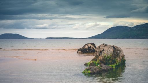 A breathtaking view of rock formations near the shore in Malinbeg, Donegal, Ireland