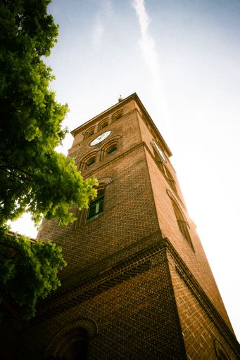 A low angle shot of church under blue bright sky in Kopenick