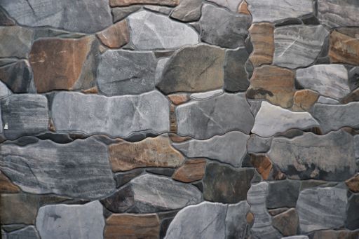 A closeup shot of a stone wall with colorful rocks - great for background or wallpaper