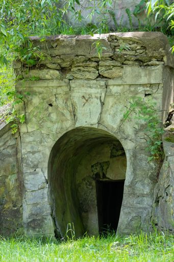 A close-up with an entrance in an old abandoned mine, concrete, romania