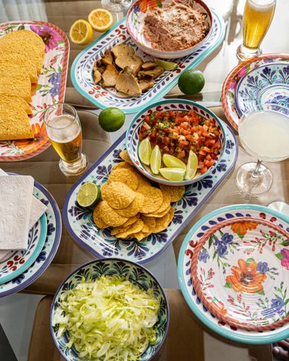 A top view of delicious Mexican Taco table with beer