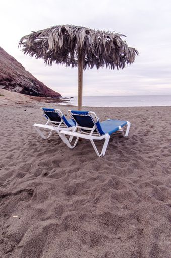 Sunbeds and Umbrella on a Tropical Beach