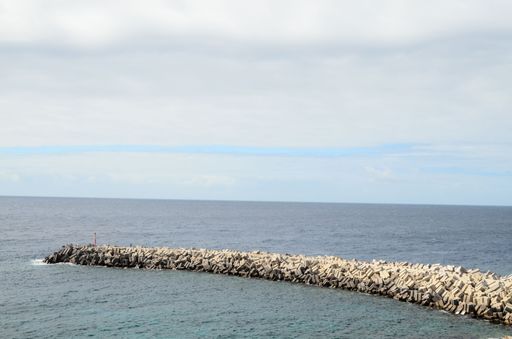Stone Pier on the blue Atlantic Ocean Water