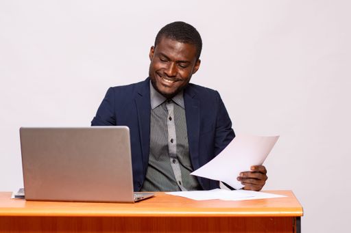 An african businessman smiling while working