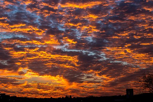 A mesmerizing low angle shot of the beautiful cloudy sky during the sunset
