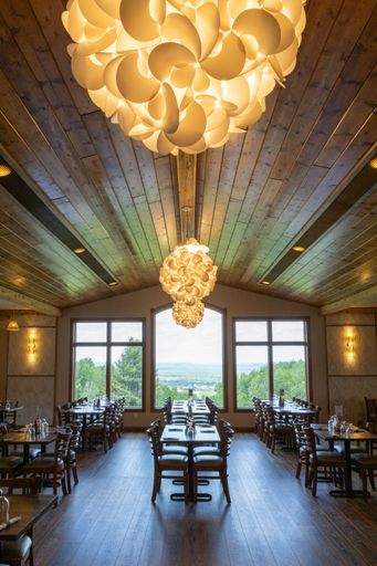 A vertical shot of a classy restaurant with beautiful views and interior